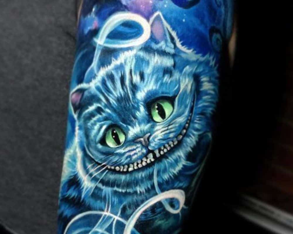 tattoo with a Cheshire cat