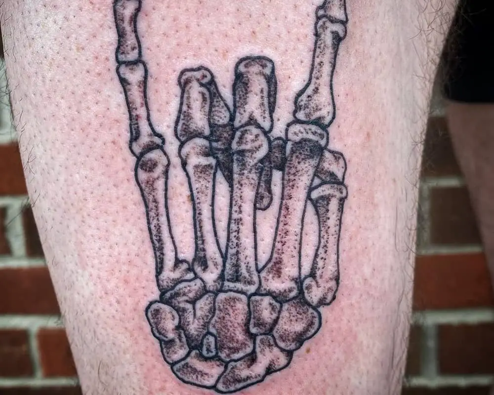 rock hand skeleton sketch for a tattoo