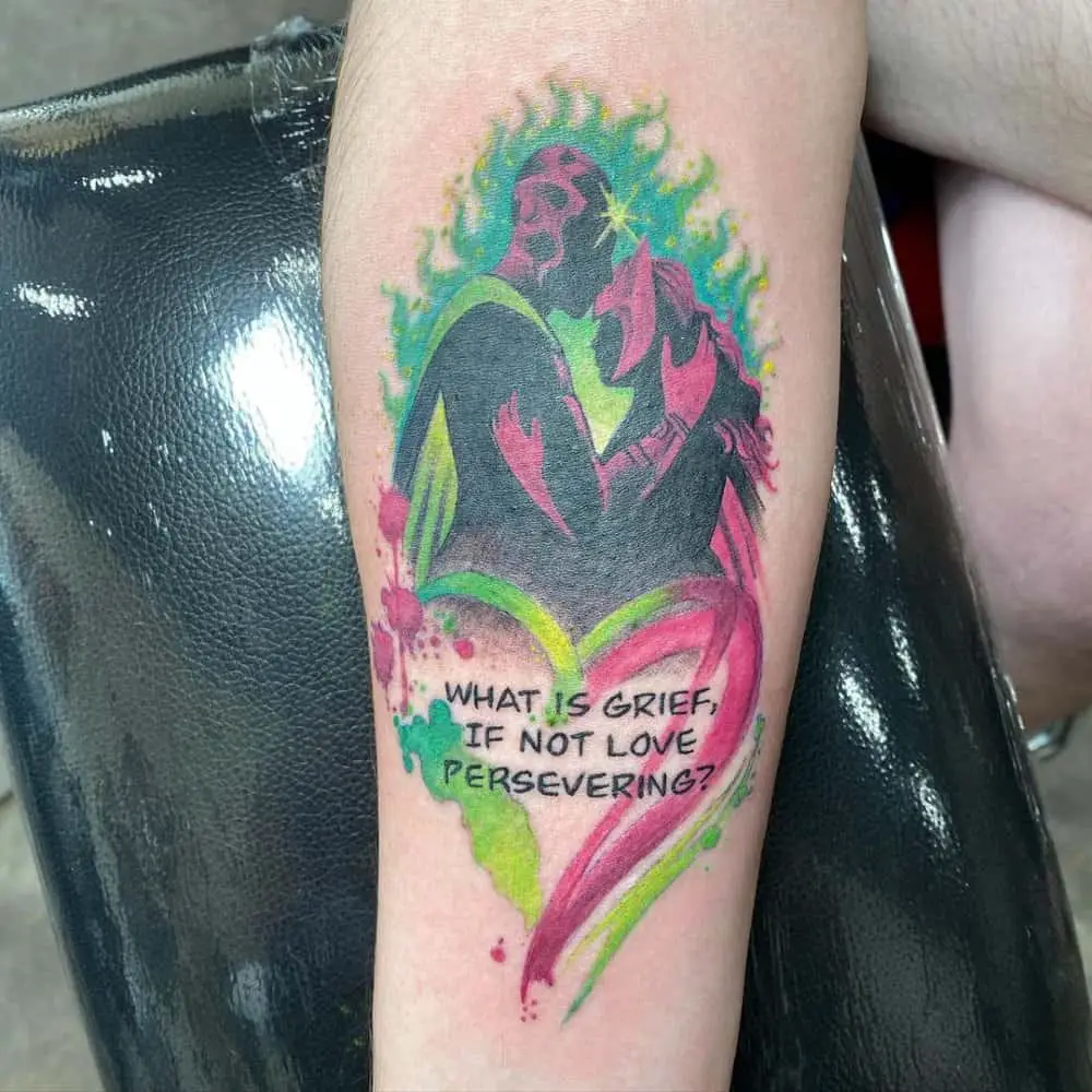 A tattoo of Wanda and Vision embracing and the inscription "what is grief, if not love persevering"