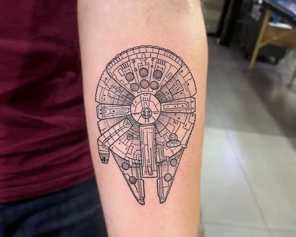 A tattoo of a millennium falcon ship