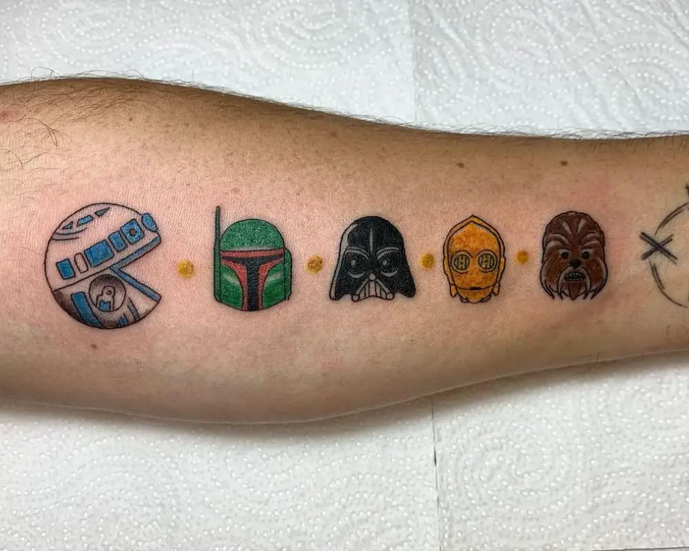 A tattoo of a pacman game with Star Wars characters