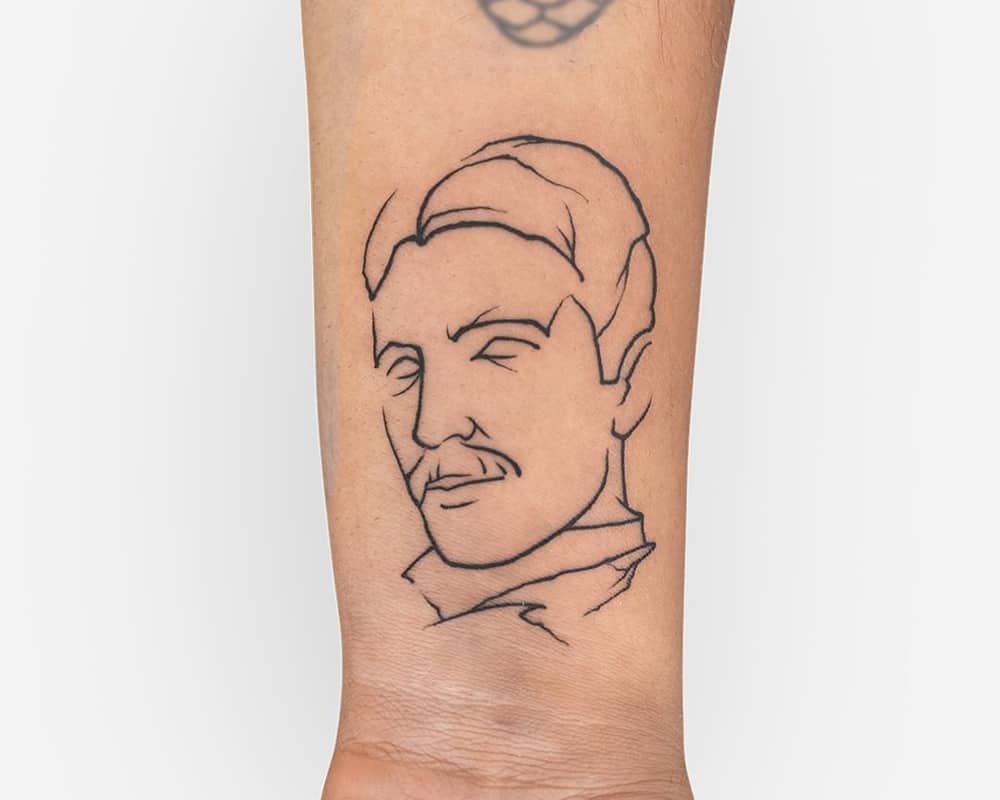 A tattoo with the image of Nikola Tesla