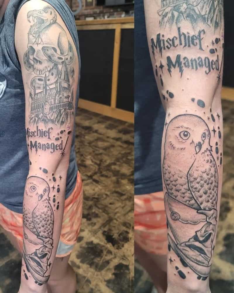 Full arm tattoo of Death Eaters, Hogwarts, owl and write Mischief Managed