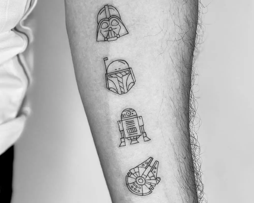 Tattoo of R2-D2, Darth Vader, Mandalorian helmets, and the Millennium Falcon