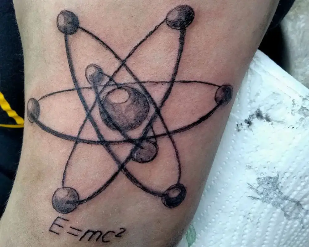 Tattoo of an atom with the formula E=mc2