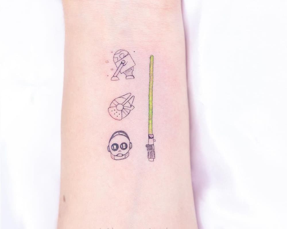 Tattoo of lightsaber, Millennium Falcon, R2-D2 and C3-PO