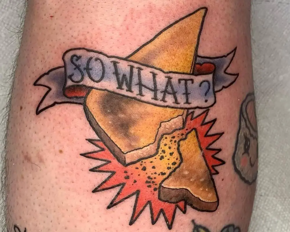 broken toast in the style of an old tattoo and the inscription "so what?"