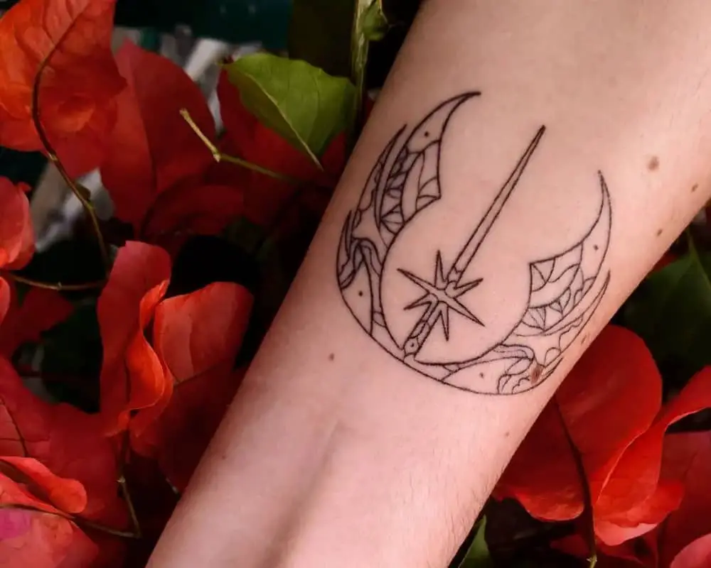 delicate patterned Alliance Starbird tattoo