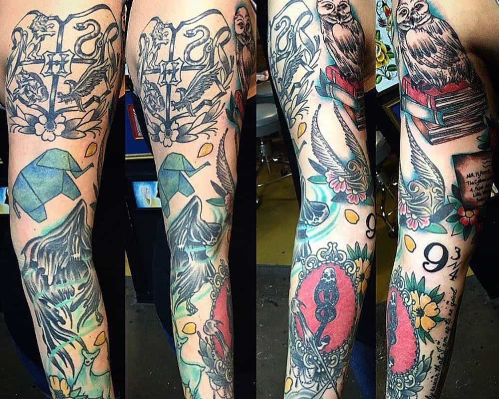 full arm tattoo with Hogwarts crest, owl and Golden snitch