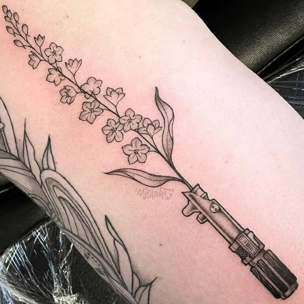 lightsaber tattoo in the form of a branch of flowers