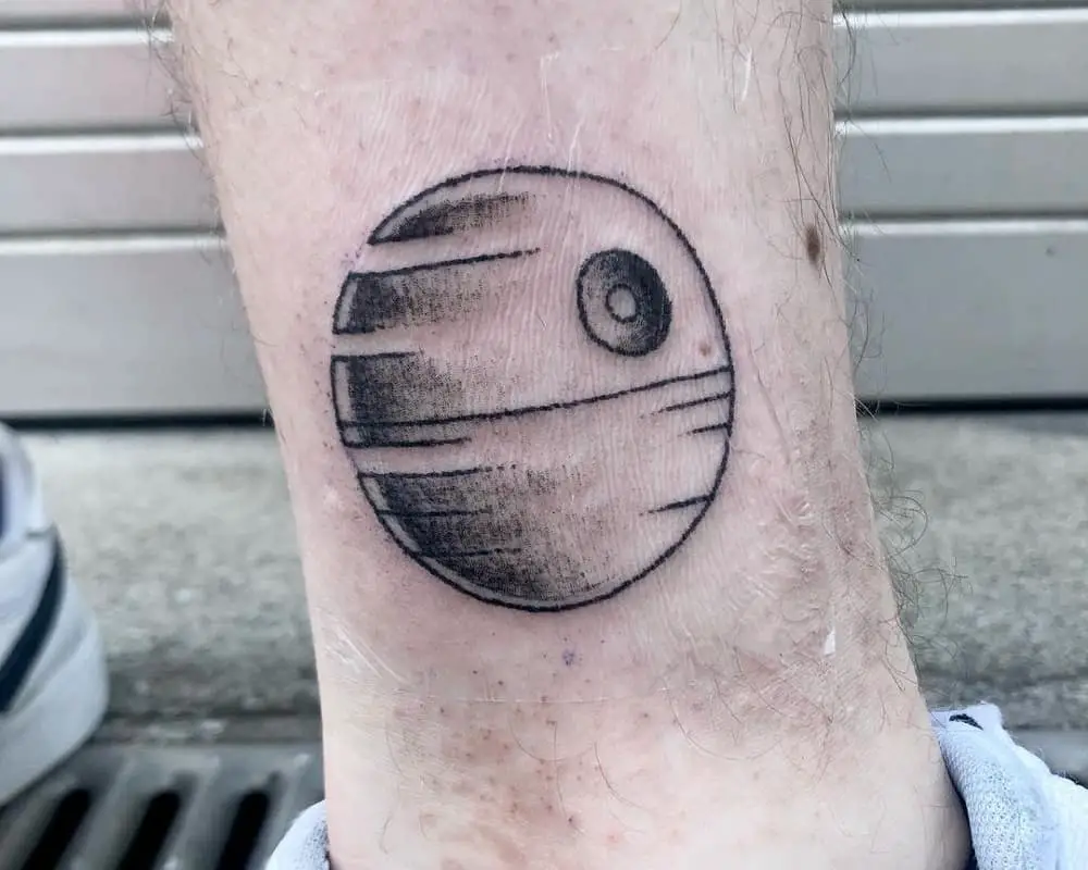 tattoo of Death Star on leg