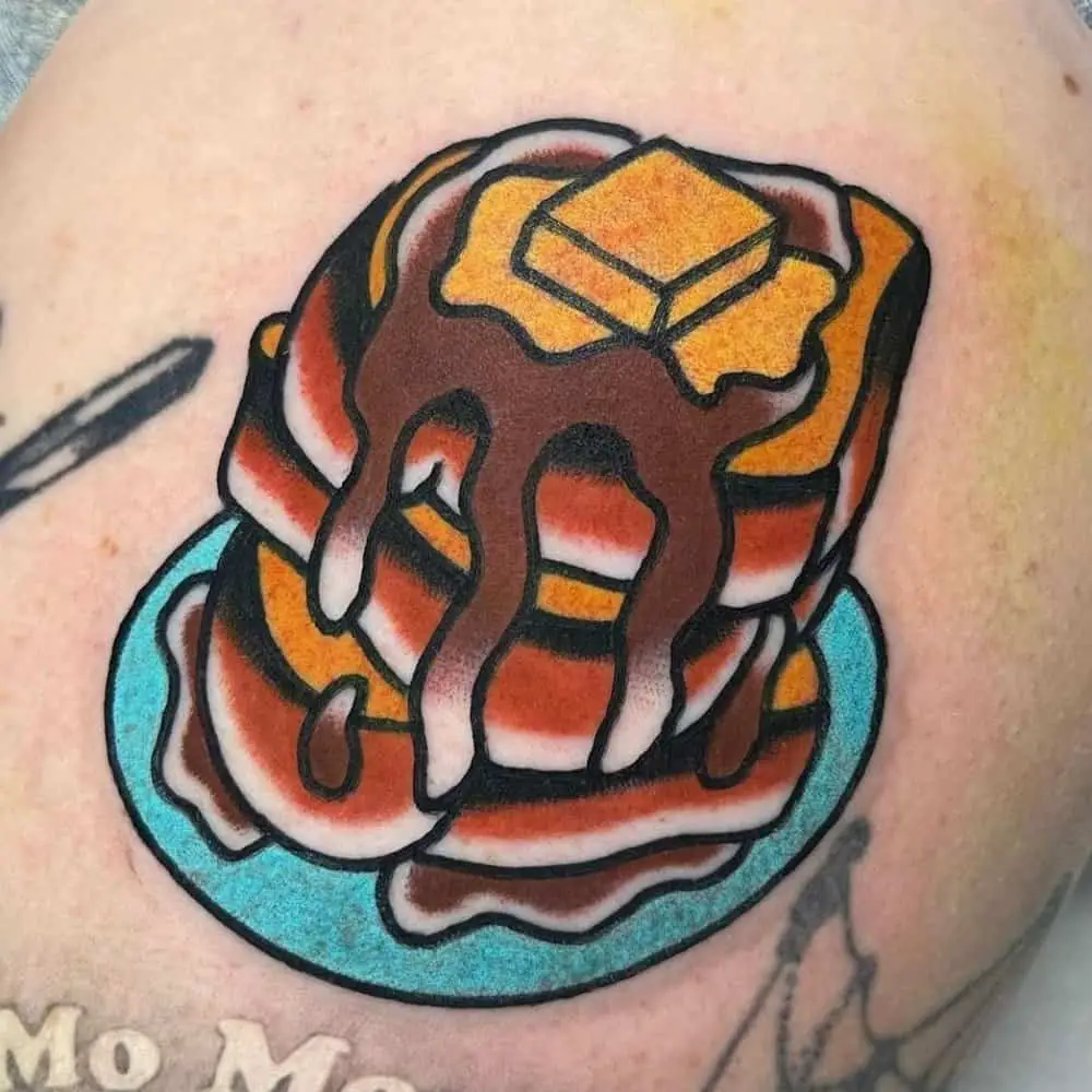 tattoo of a mountain of sweet toast on a plate