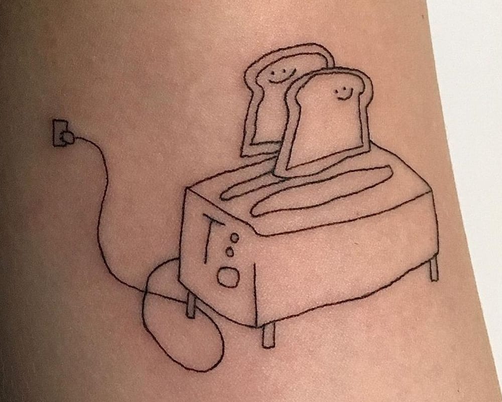 tattoo of a simply drawn toaster and two toasts