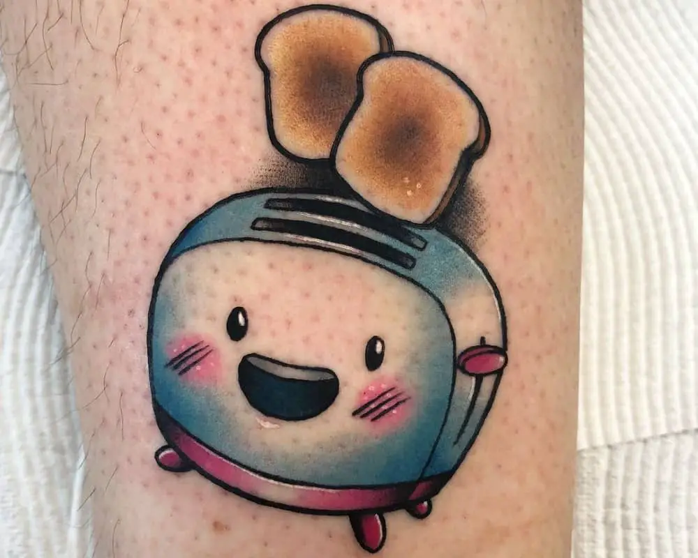 tattoo of a smiling toaster with two toasts flying out of it