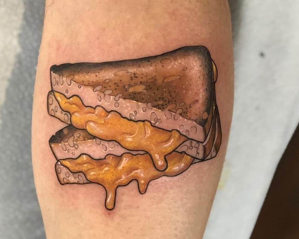 tattoo of toast with cheese sliced into triangles