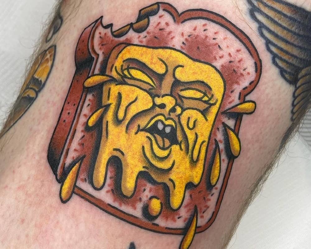tattoo of toast with cheese that cries
