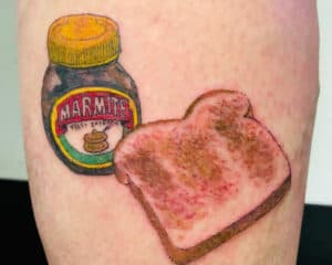 tattoo with toast and a jar of marmite pasta