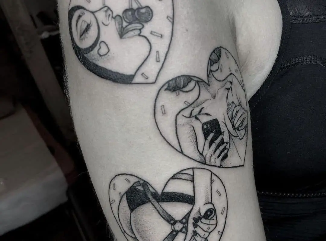 3 hearts with BDSM scenes in the centre tattoo