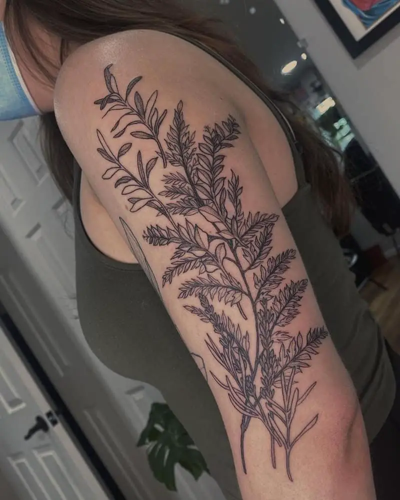 A large tattoo in the form of intertwined plant branches