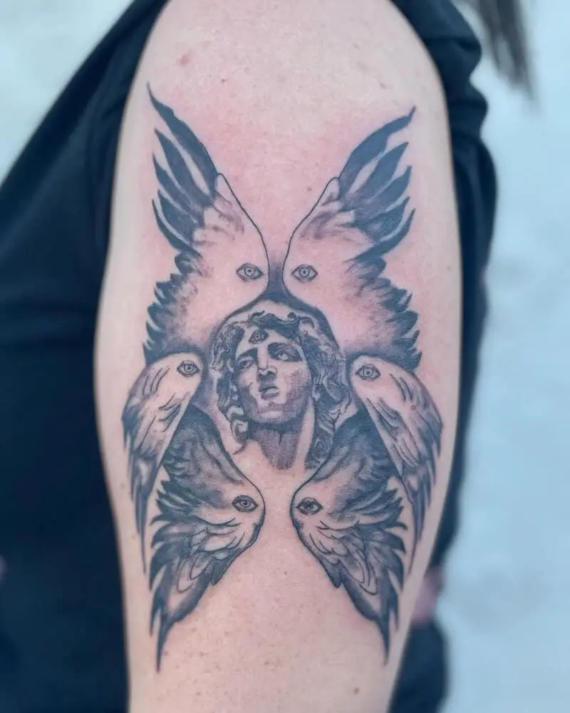 A tattoo in the form of a six-winged angel with an eye in the center of his forehead