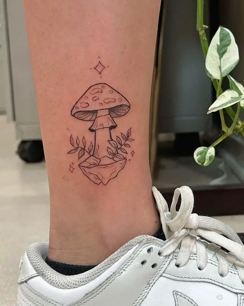 A tattoo of a beautiful mushroom on the ankle