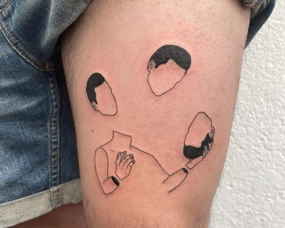 A tattoo of a body juggling three heads