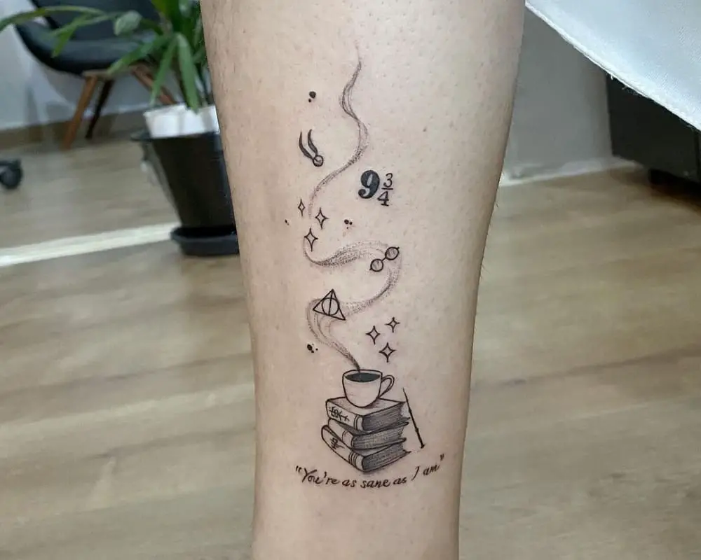 A tattoo of a book, a cup, a magic wand and the inscription You're as sane as I am