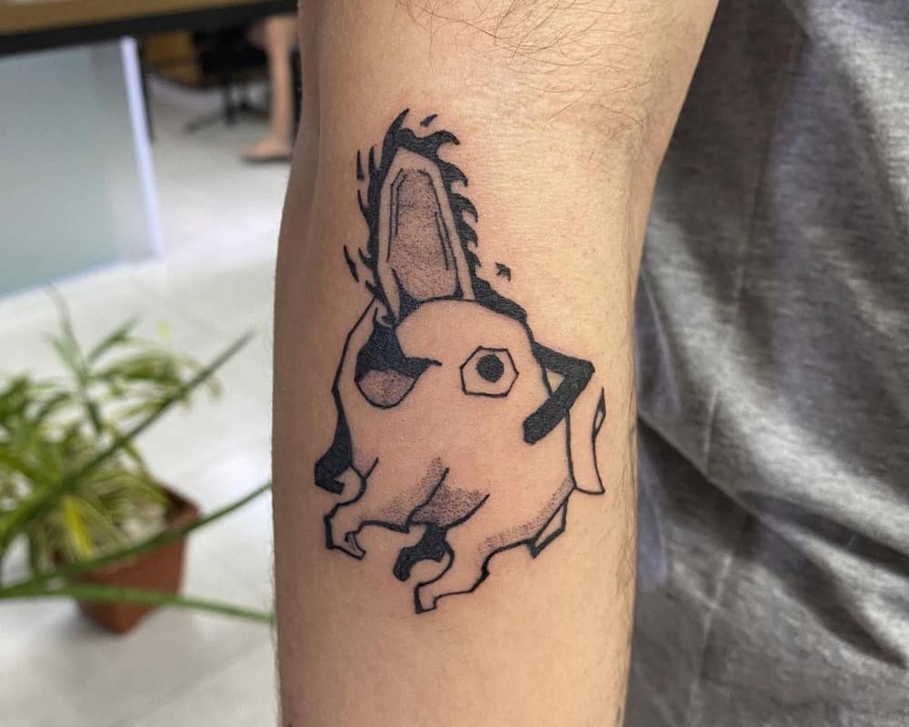 A tattoo of a jolly demon-dog