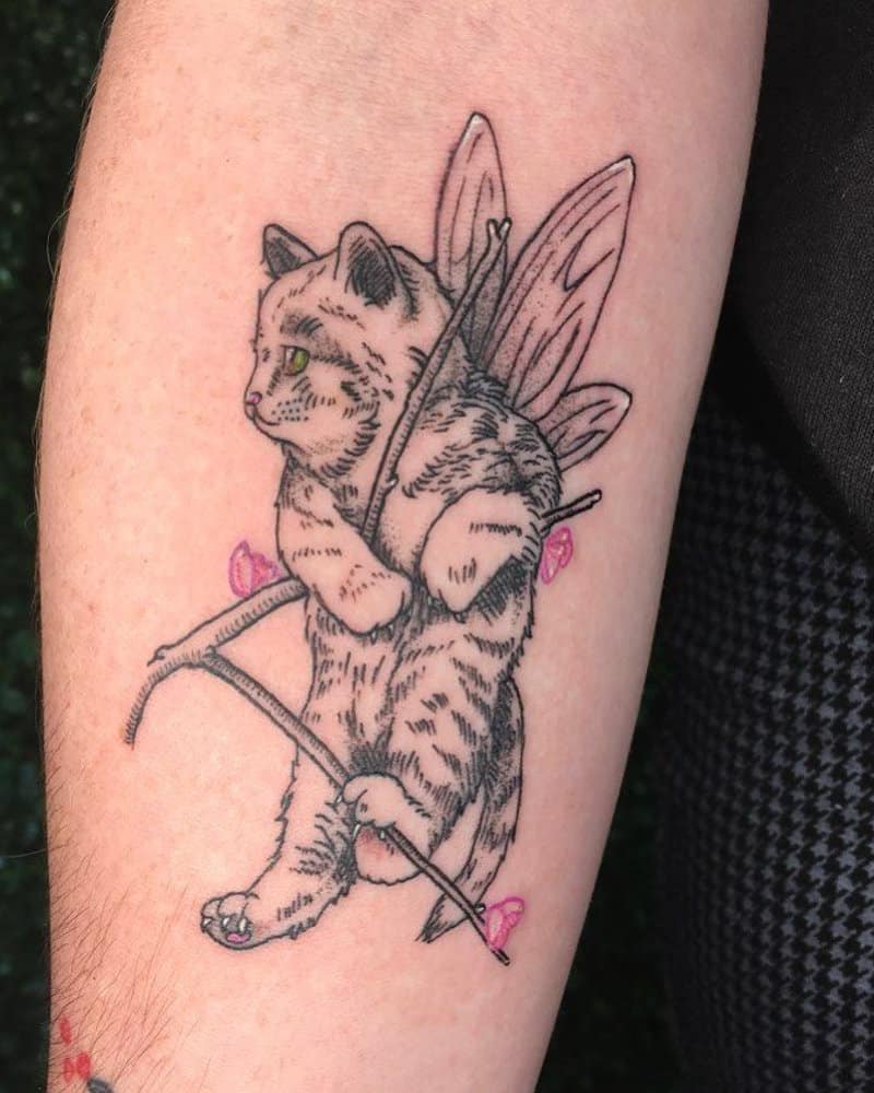 A tattoo of a kitten with wings