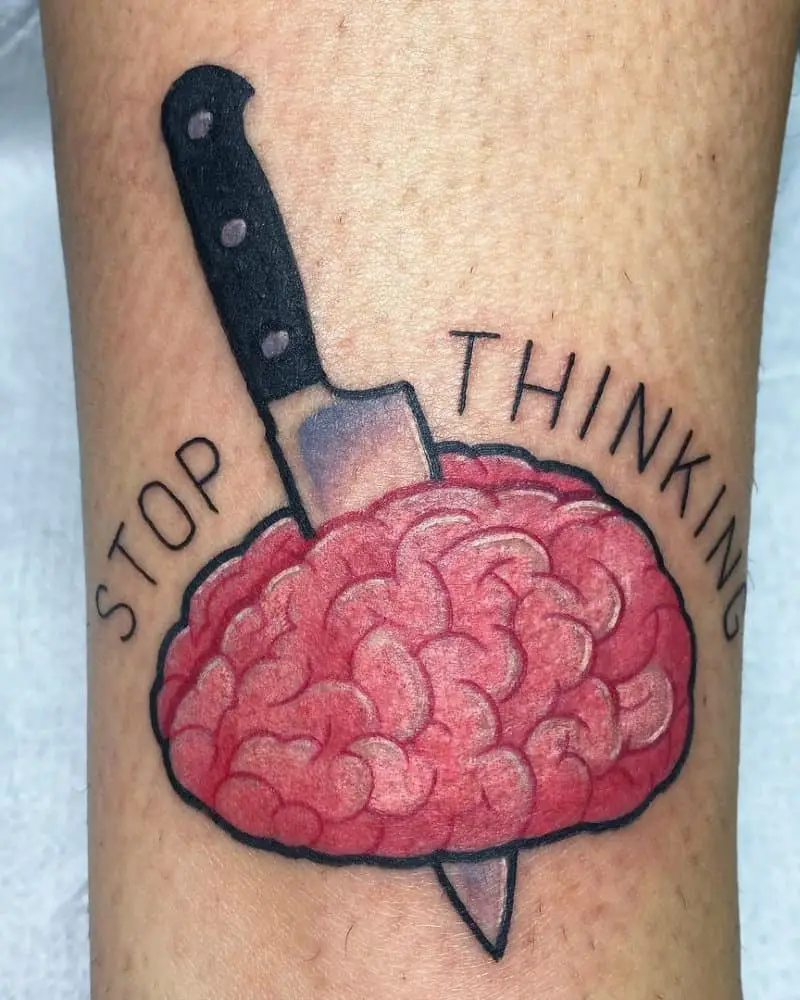 A tattoo of a knife stuck in the brain and the inscription stop thinking