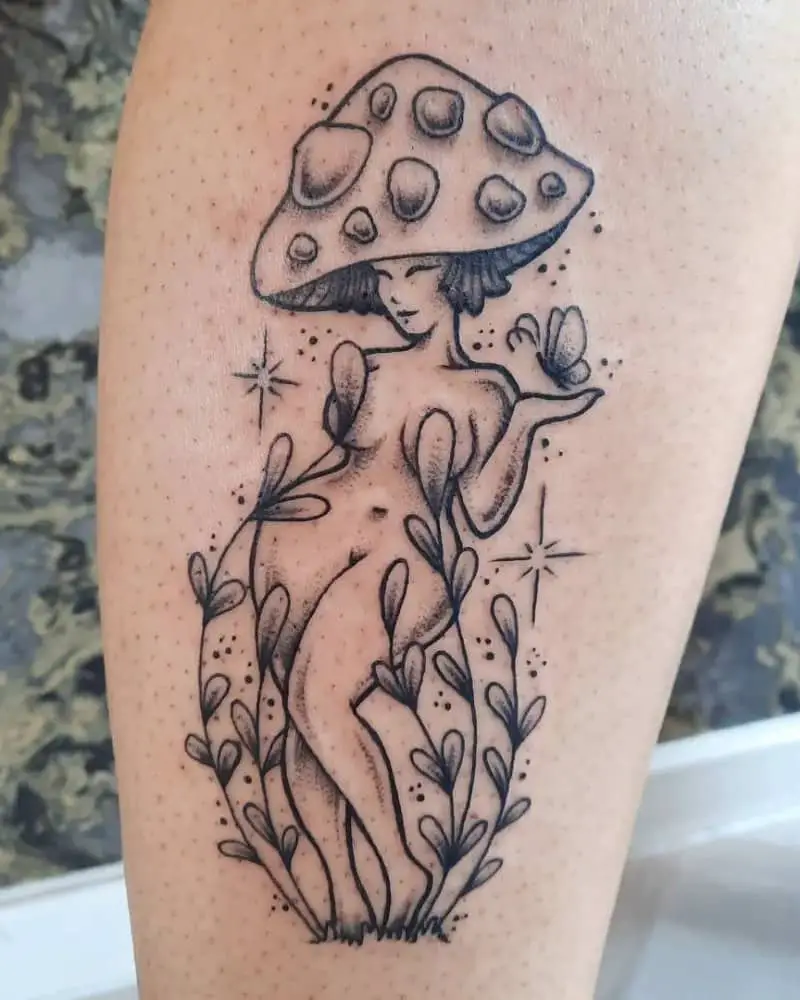 A tattoo of a naked girl with a mushroom cap