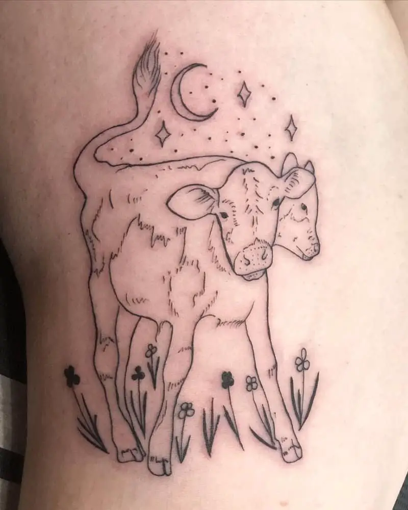 A tattoo of a two-headed calf in a meadow under the stars and the moon