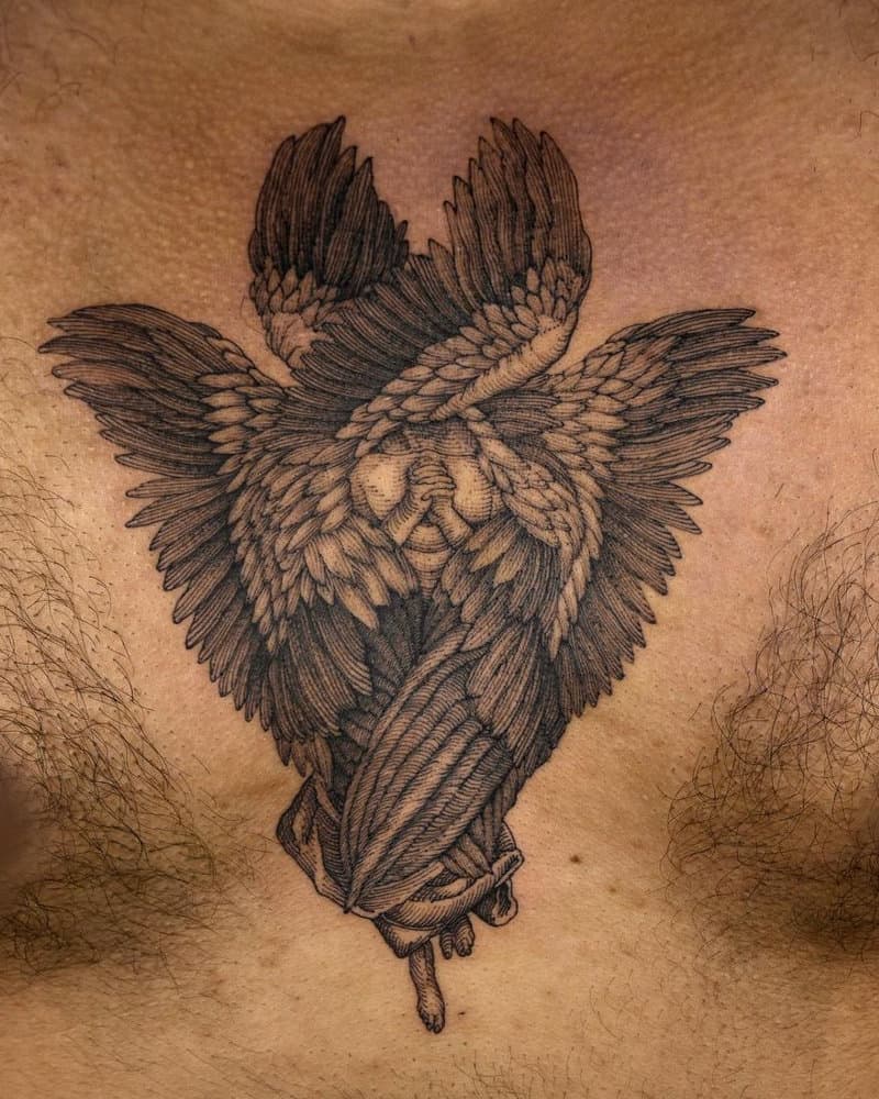 A tattoo of an angel with six wings and folded arms in prayer