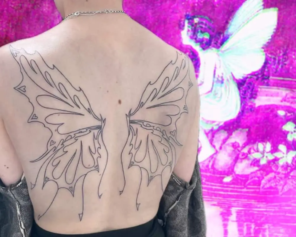 A tattoo of butterfly wings across the back