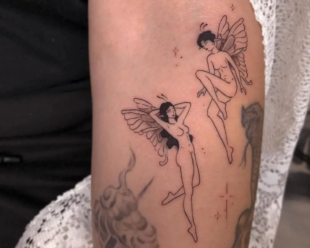 A tattoo of two flying fairies