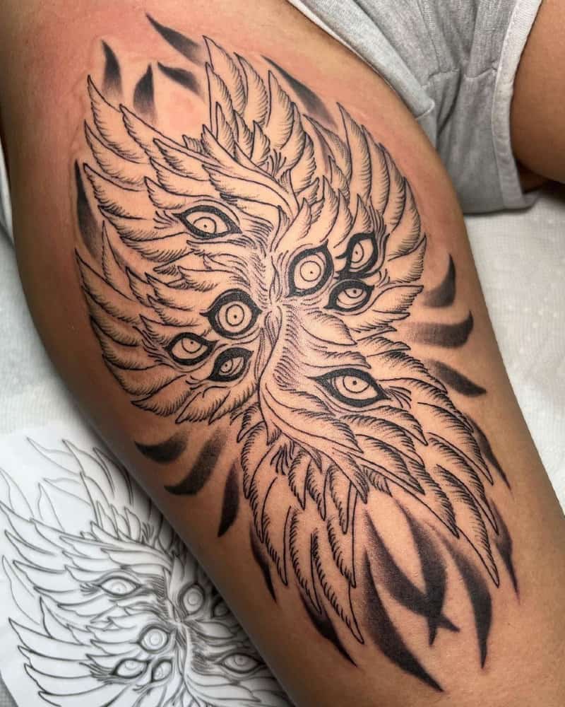 A tattoo showing three pairs of wings with eyes