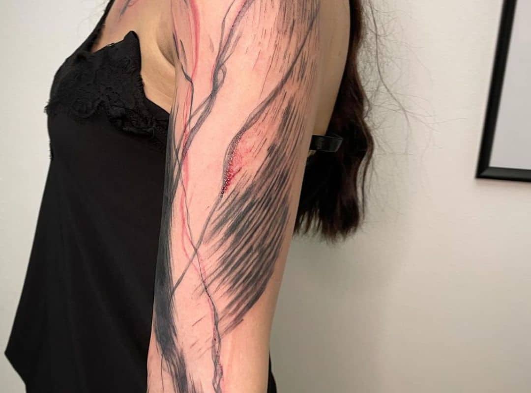 Abstract black and red lines tattoo