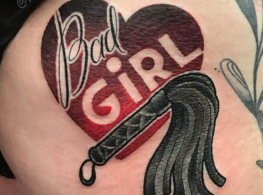 Heart with the sign and a whip tattoo