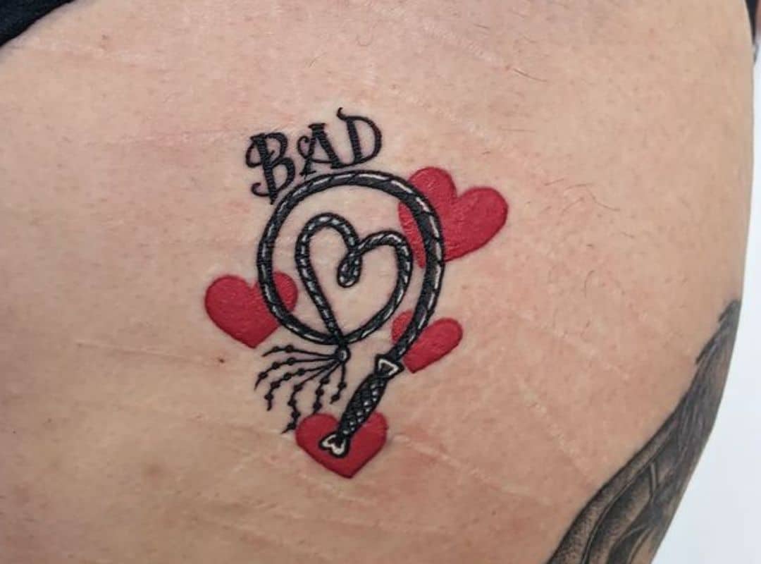 A whimp in a form of heart tattoo
