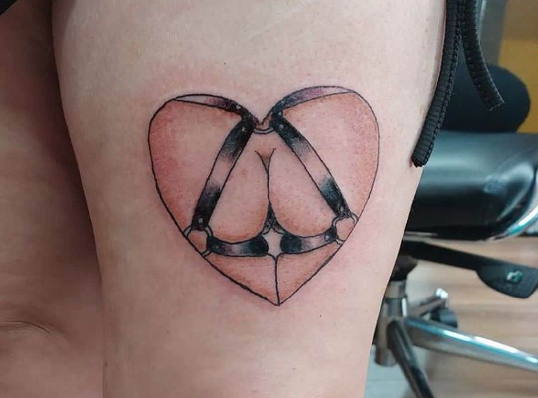 Heart with straps tattoo