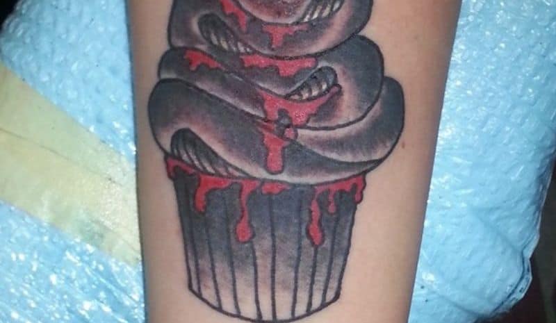 Black cupcake with blood tattoo
