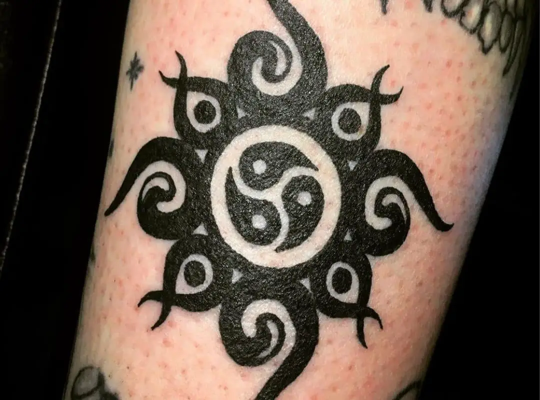 BDSM logo with an ornament tattoo