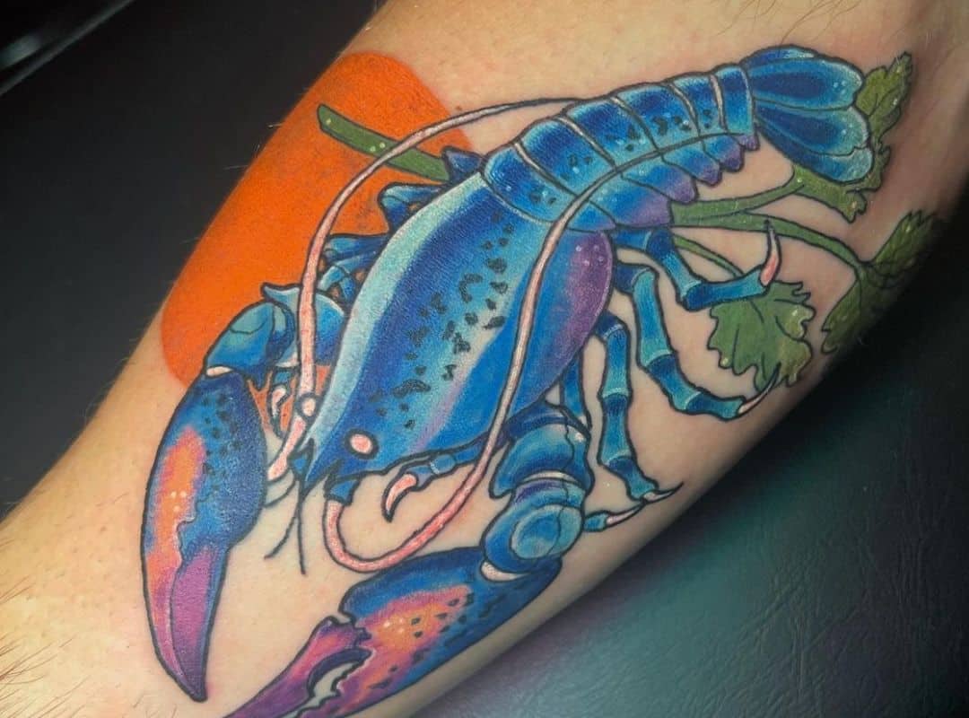 Blue lobster with son on the background tattoo