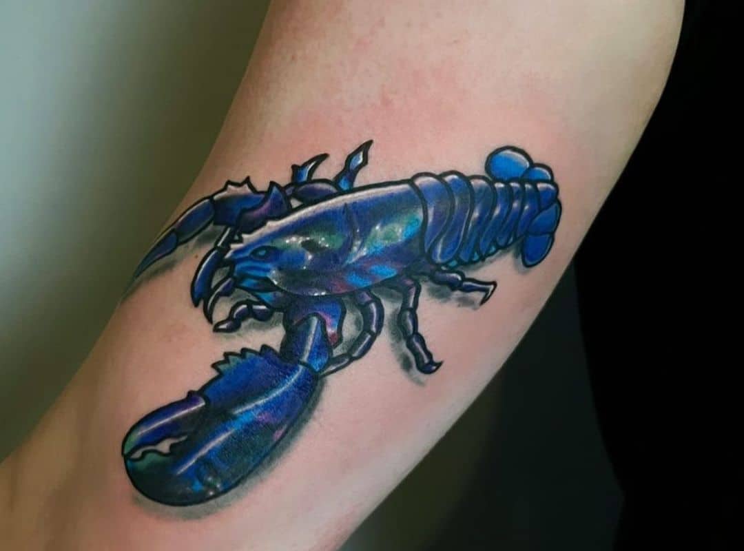 Blue lobster hand tattoo