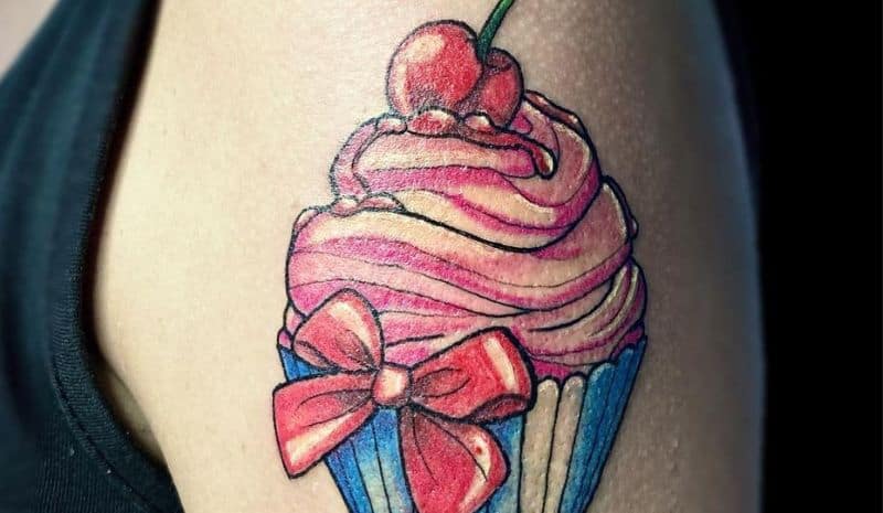 Blue&pink cupcake with cherry and bow arm tattoo