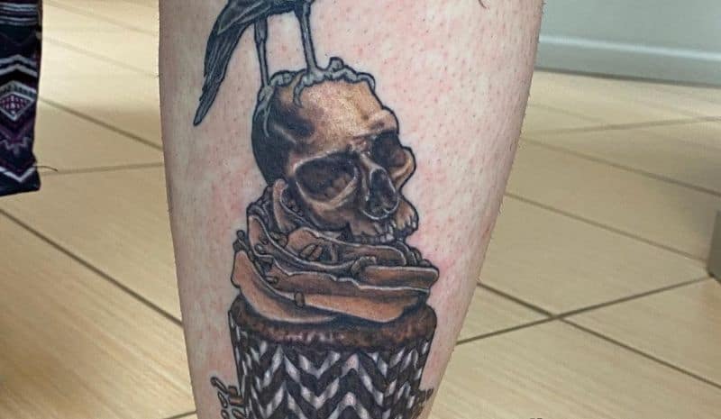 Brown cupcake with a skull on the top tattoo