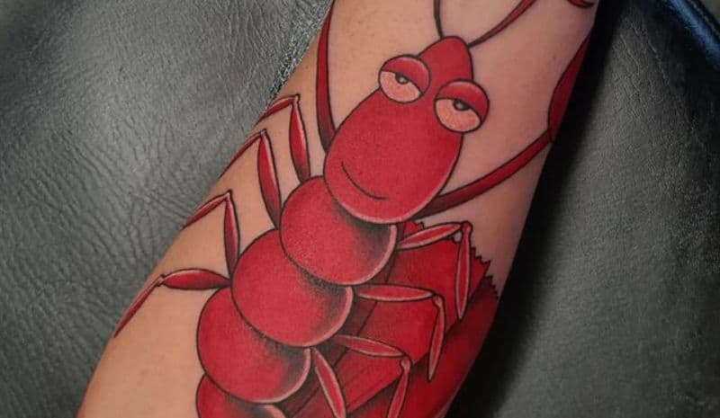 Cartoonish red lobster with big eyes tattoo
