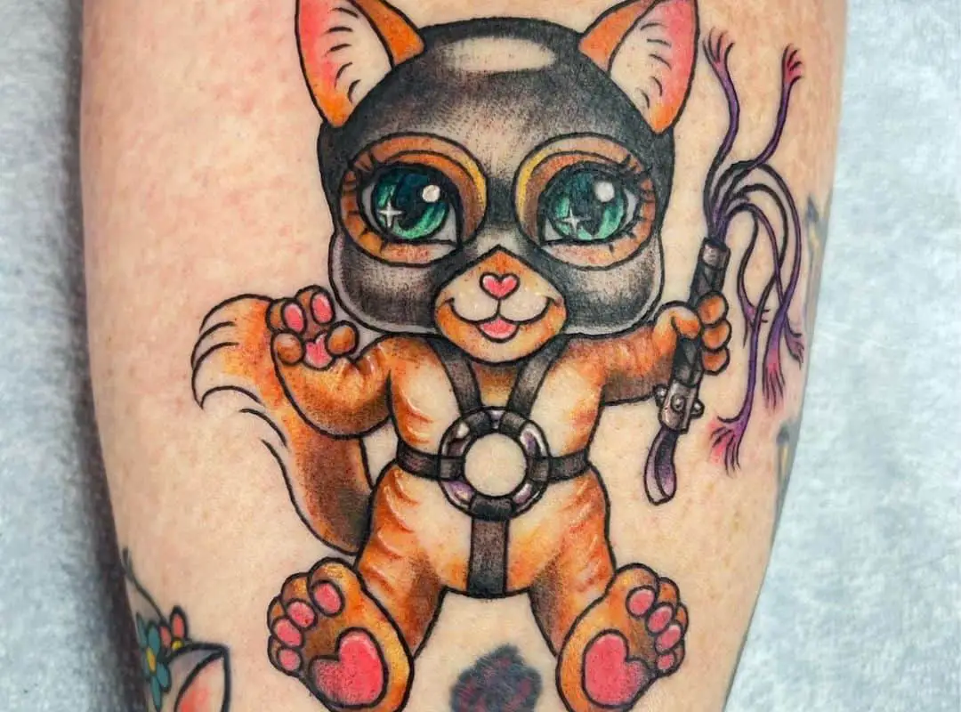Cat in the mask and the whip tattoo