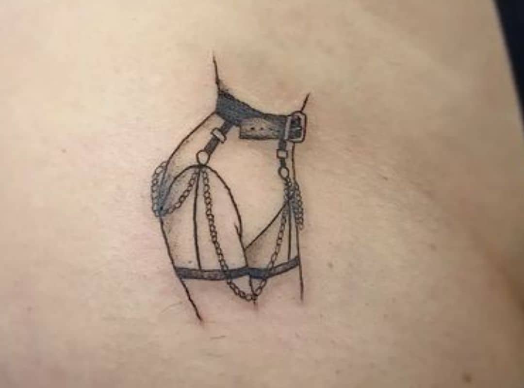 Silhouette with belt and chains tattoo