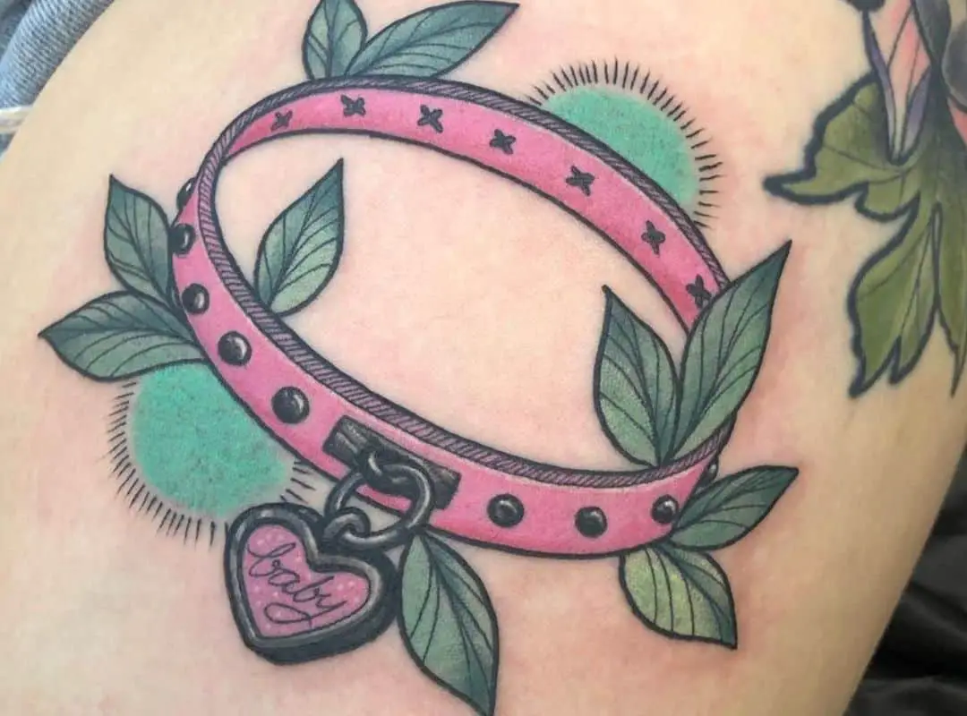 Pink collar with leaves around tattoo